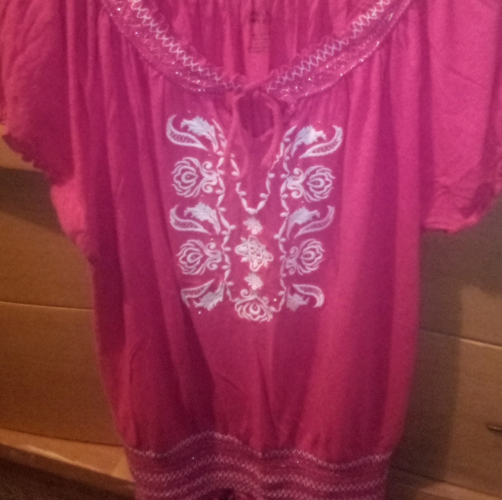 Women's pink county style peasant top.